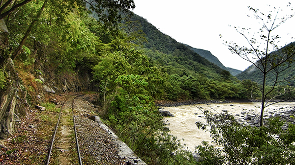 Train track skirting Padas River, Sabah, Malaysia