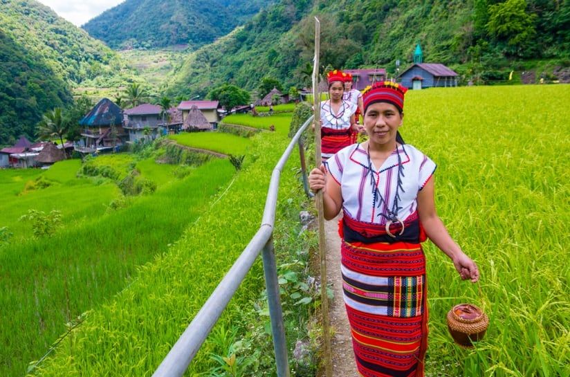 Women from Ifugao Minority near a rice terraces in Banaue the Philippines / Shutterstock